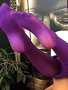 Busty slut gets indecent and starts fingering cunny through her purple pantyhose