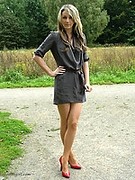 Red high heels and shiny pantyhose always look good in the outdoor sunshine