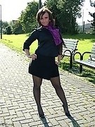 Gorgeous black high heels and pantyhose on this babe as she poses outdoors